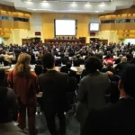 group of speakers at a conference